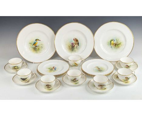 A Royal Worcester porcelain part tea and dessert service, each piece hand painted with a bird and signed D Jones, comprising 