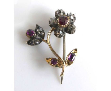 A George III yellow and white metal, ruby and diamond floral posy brooch, with four rubies and seven rose cut diamonds, all i