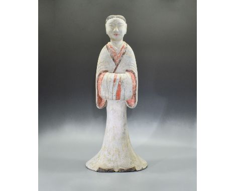 ,Ca. 200 BC Large Chinese Han Dynasty pottery female attendant holding her arms in front of her body. She is made from light 