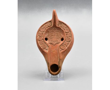 Ca. 400-500 AD. Ancient moulded clay oil lamp with circular panel depicting a Star and floral decoration. Early Christian ico