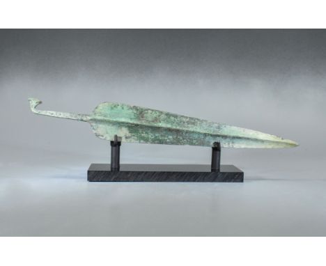 ca. 800 BC. Greek Archaic period sword blade with handle. A beautiful and sizeable cast bronze; It has a slender blade profil