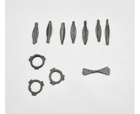 CA. 700 BC. Interesting collection of 11 Celtic bronze proto money objects – including arrows, bells, knobbed rings. It is be