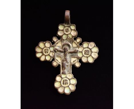 Ca. 1600 AD. Superb cast cross pendant depicting crucified Jesus Christ; each terminal expanding into a floral pattern with a