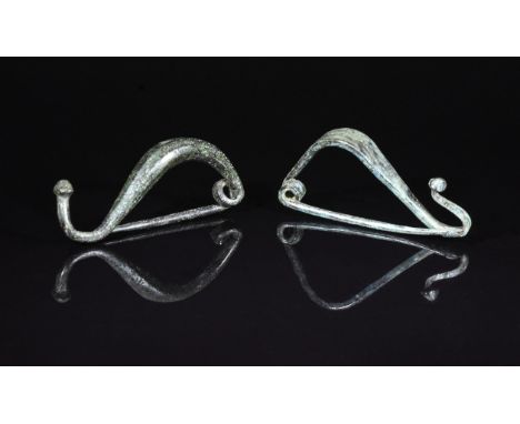 Ca. 300 BC. Interesting pair of Celtic, Iron Age, la tene type bow brooches. Expertly cleaned and conserved with smooth green