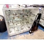 Approximately 20 x various chrome mixer taps to glass cabinet (included) with shower system. This