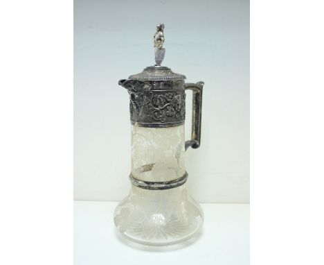 A Victorian silver mounted claret jug, by Gibson and Langman, Birmingham 1885, the cylindrical glass body with compressed bas