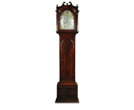 A George III mahogany eight day longcase clock, the break arch hood with small swanneck pediment, 12inch brass dial with stri