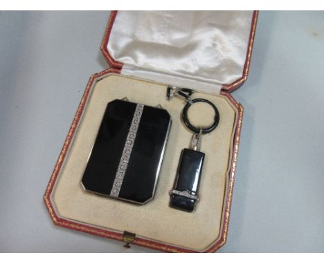 Boucheron and Cartier: a matched art deco make up suite in black enamel set with diamonds, the principal piece a rectangular 
