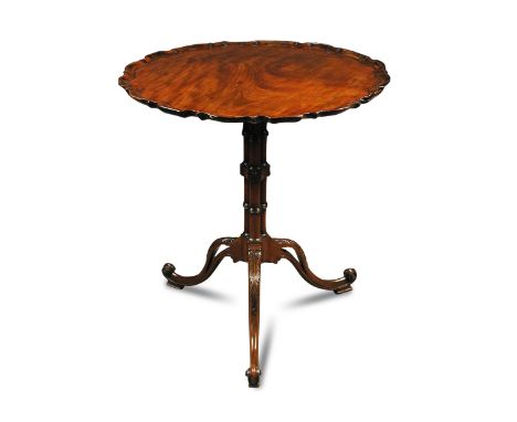 A mid 18th century style mahogany tripod table, with pie-crust moulded border, on a cluster column, leaf carved and scroll le