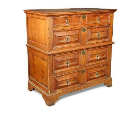 A 17th century pine chest in two halves, with moulded drawer fronts, brass drop handles and on bracket feet 104 x 103 x 59cm 