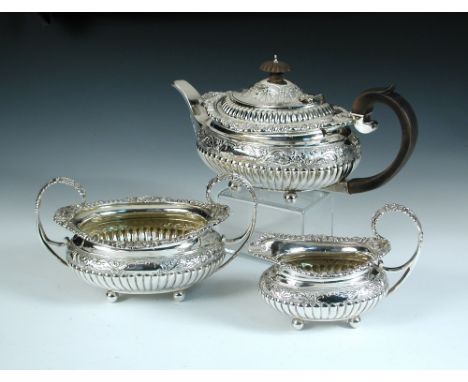 A late Victorian silver three piece teaset, by The Barnards, London 1898, comprising a teapot of compressed oval form, the bo