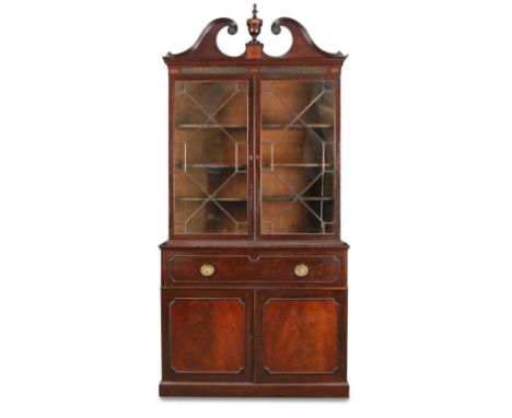 A George III mahogany secretaire bookcase, with swan neck pediment with inlaid urn finial and frieze, fitted writing drawer, 