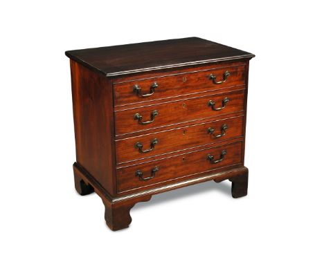 A George III mahogany commode chest, with original fitments, faux drawer fronts, on bracket feet with label 'CHATSWORTH' to t