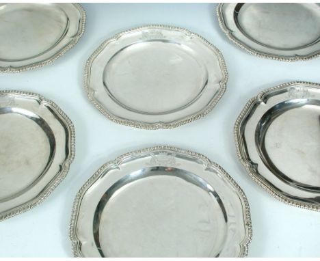 A set of six Victorian silver dessert plates, by R Garrard, London 1868, each of circular shape with lobed gadrooned edge aro