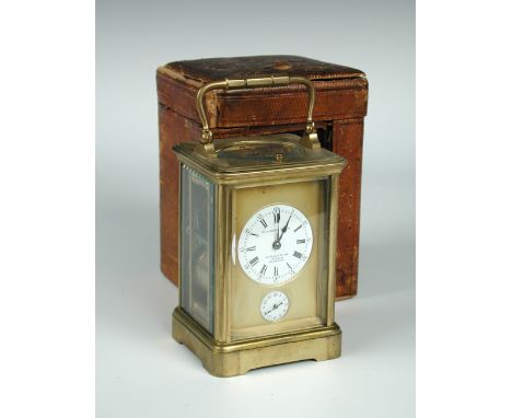 A French brass carriage clock with alarm and repeat, the enameled dial marked for Goldsmiths' Company, alarm dial below, with