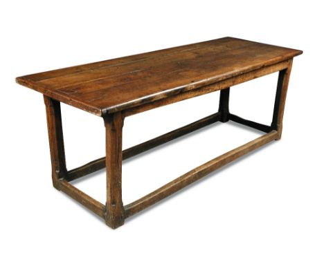 A 17th century oak refectory table with cleated ends, and on stretchered square chamfered legs 76 x 221 x 81cm (30 x 86 x 32i