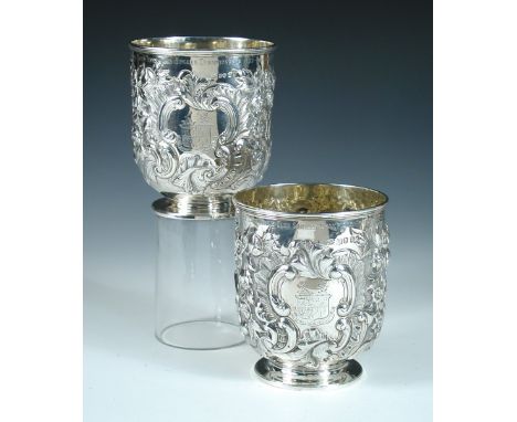 A pair of George IV silver planters, by Charles Fox, London 1829, of cylindrical form on short pedestal, the body embossed al