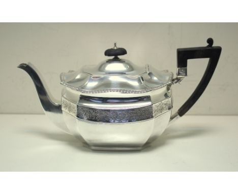 An Edwardian silver teapot, by James Dixon & Sons, Sheffield 1904, of canted rectangular form the upper body with a band of e