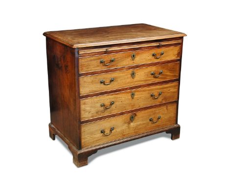 A George III mahogany chest of drawers, with a brushing slide and four long graduated drawers, brass swan neck handles and on