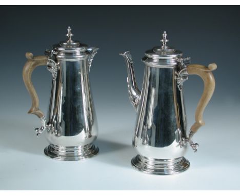 A modern silver cafe au lait set, by C J Vander Ltd, London 1968, comprising:- a plain baluster shaped coffee pot with leaf c