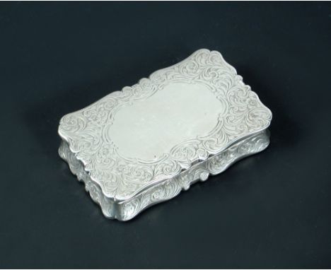 A large Victorian silver pocket snuff box, by Frederick Marson, Birmingham 1856, of rectangular form with serpentine edges, a