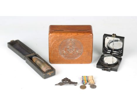 A small collection of various militaria, including a novelty shell case pepperette, detailed with the crest of the Royal Arti