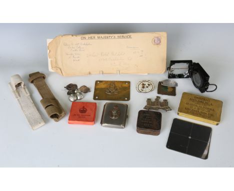 A collection of various early/mid-20th century militaria, including an aluminium wrist identity tag to 'Pte. T. Obee 23 Middl