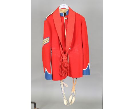 A post-1952 Guards Regiment parade uniform, comprising jacket with staybright buttons, trousers and sash.Buyer’s Premium 29.4