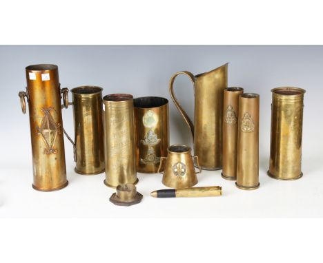 A group of various trench art shell cases, including a pair of 40mm cases with applied Royal Army Ordnance Corps badges, both