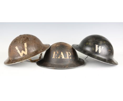 A collection of five Second World War period British army Mk II Brodie helmets, including examples painted for 'FAP' [First A