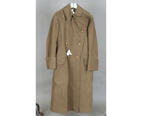 A Second World War period army greatcoat with Royal Pioneer Corps buttons and interior label detailed 'Burberrys', together w