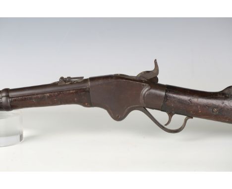 An 1860s Spencer .508 repeating three-band percussion rifle, barrel length 72cm, with fixed front site, hinged rear ladder si
