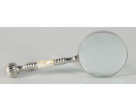A MAGNIFYING GLASS with a chrome and mother of pearl handle.