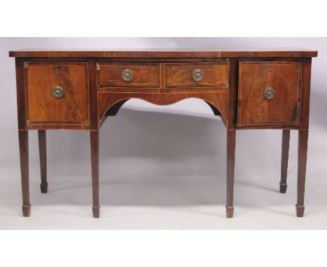 A GEORGE III MAHOGANY SERPENTINE FRONTED SIDEBOARD with crossbanded top, central drawer formed as two short drawers, flanked 