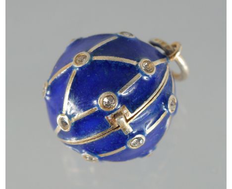A SILVER AND BLUE ENAMEL BALL PENDANT. .75ins