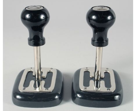 A PAIR OF GEAR STICK PAPERWEIGHTS. 7ins high.