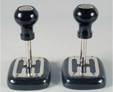 A PAIR OF GEAR STICK PAPERWEIGHTS. 7ins high.