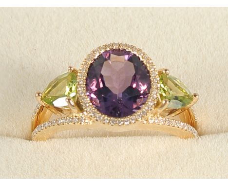 AN 18CT GOLD, AMETHYST, PERIDOT AND DIAMOND RING.