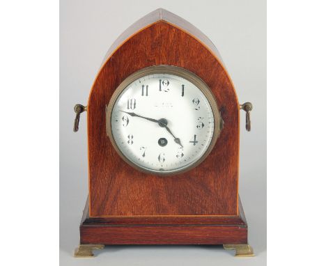 AN EDWARDIAN MAHOGANY MANTEL CLOCK, Maple and Co., London. 10ins high.