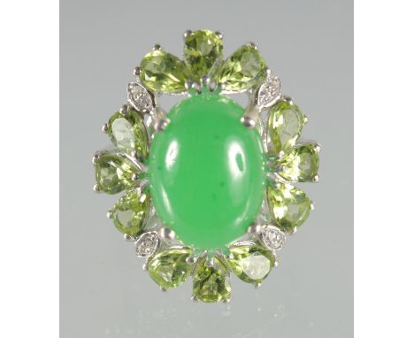 A SILVER JADE AND PERIDOT RING.