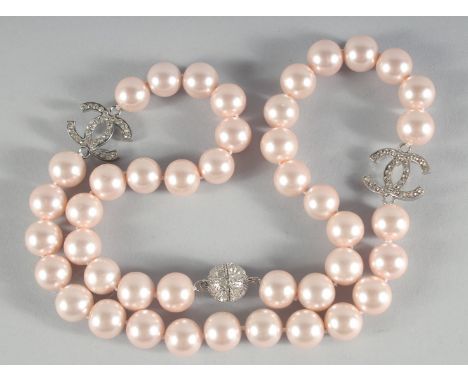 A CHANEL LARGE 43 PEARL NECKLACE with brilliant set double C clasp.
