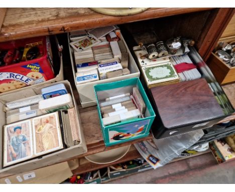 Four boxes of vintage playing cards, etc.