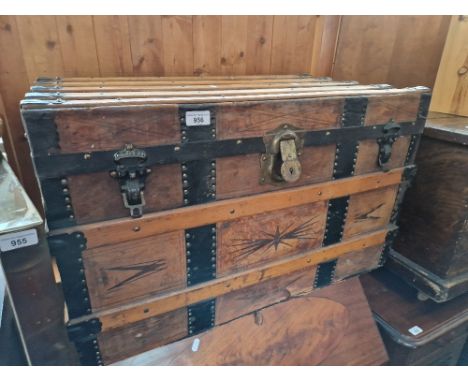 A vintage leather bound travel trunk. Dimensions- height 48cm, length 79cm and width 47cm.