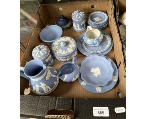 A box of blue Wedgwood jasperware.&nbsp;Condition - repair to finial on lid (no matching jar), chip to small dish.