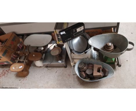 A collection of vintage weighing scales and weights together with two electric shop scales. 