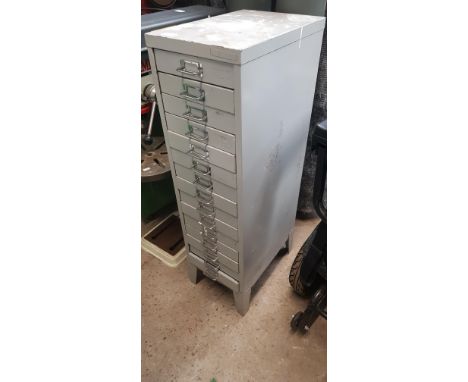 A mixed lot comprising filing drawers, grinder, and tools.