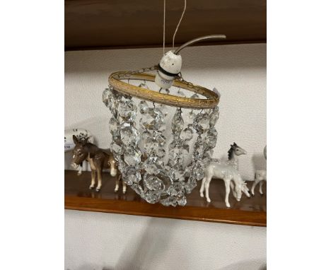 A hanging glass drop light fitting 