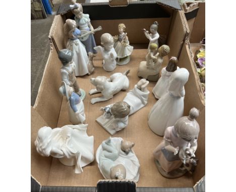 A box of assorted figures, mainly Nao, other Spanish figures including Lladro and other ornaments. Condition - one figure wit