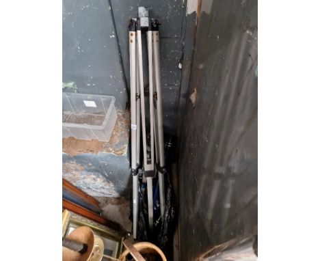 A telescope with tripod and a Slik 88 camera tripod. 
