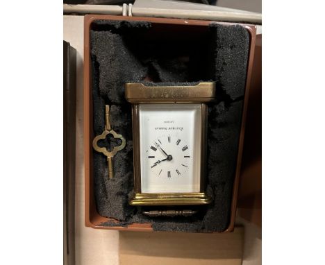 A boxed Mathew Norman brass carriage clock. 